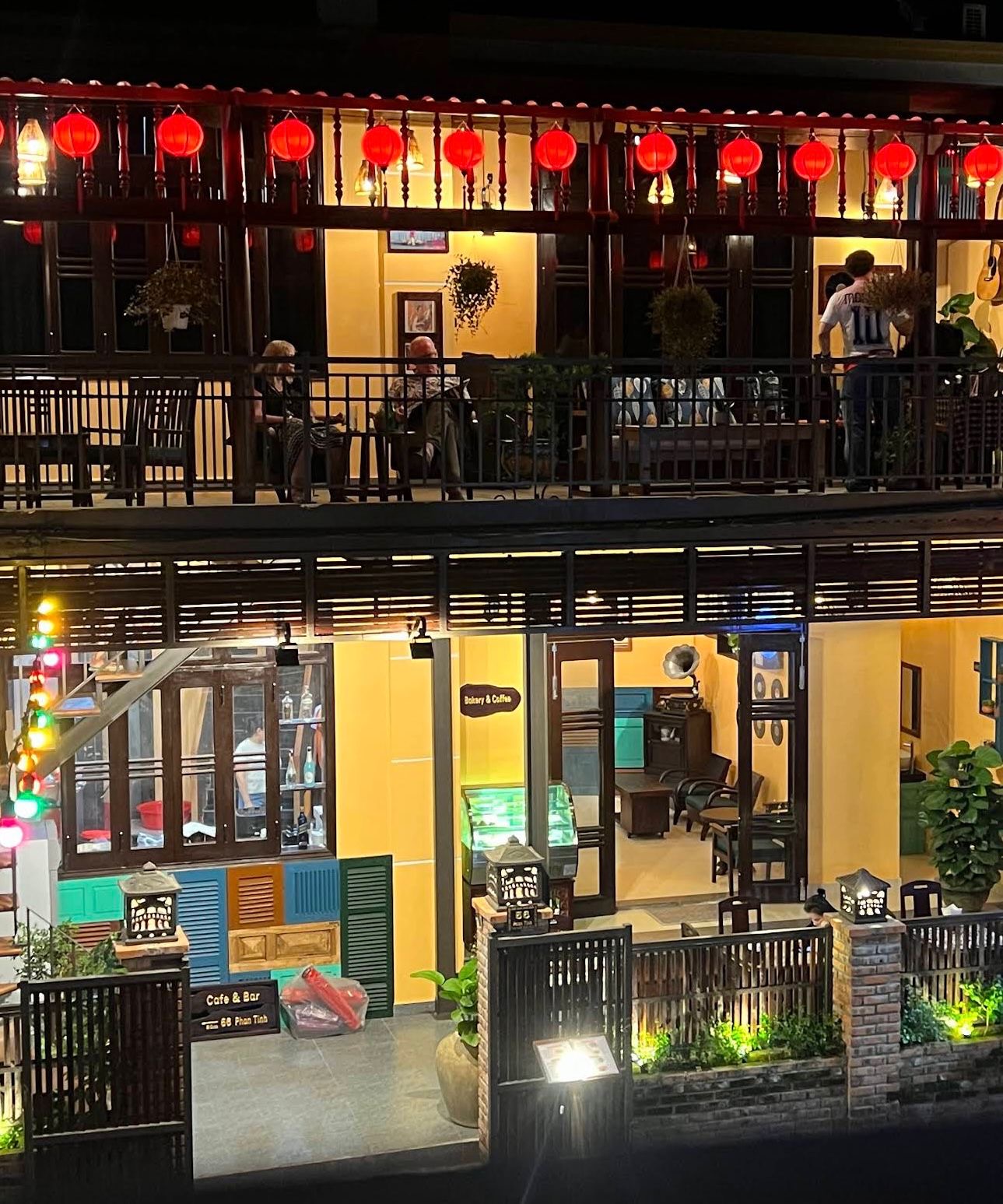 Guests on the balcony at An Restaurant & Bar in the evening